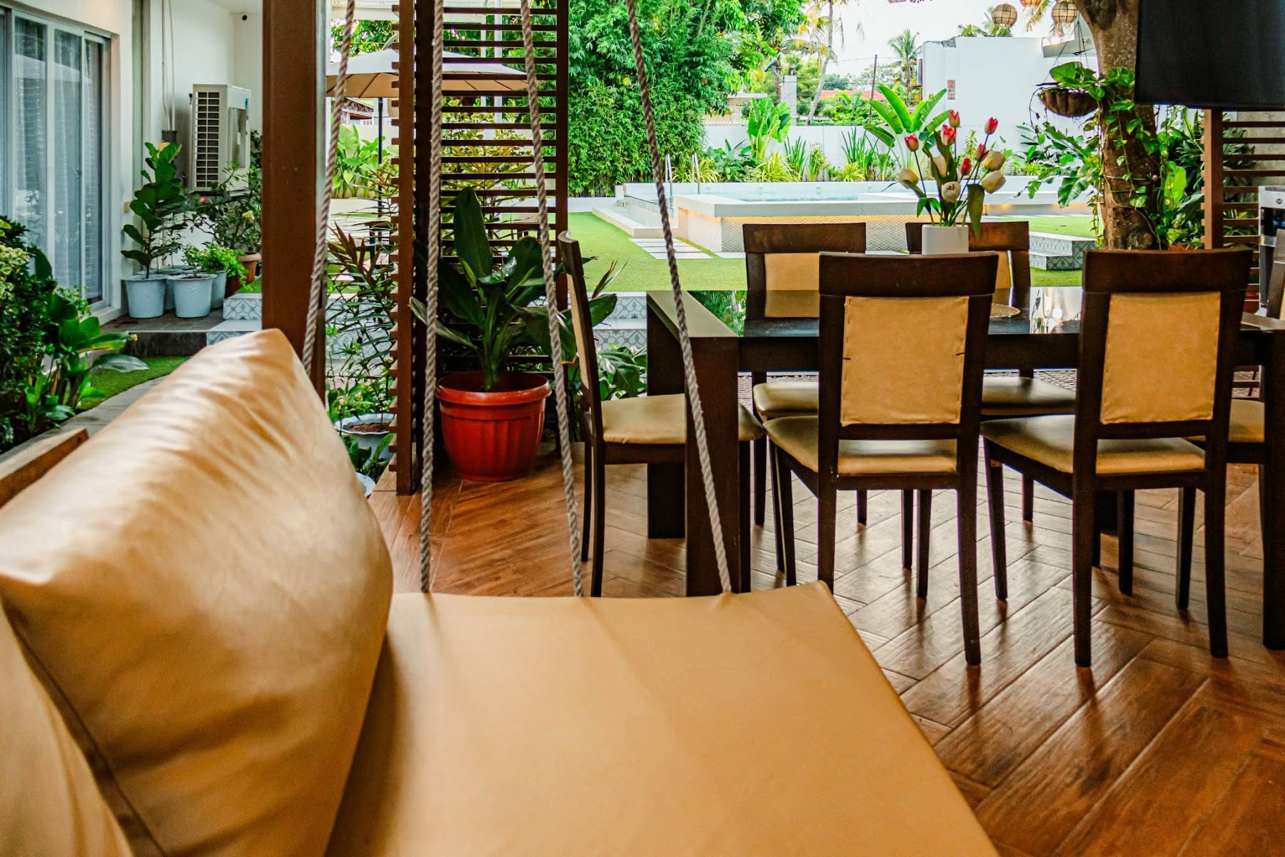 The White Lily pergola seating overlooking the pool